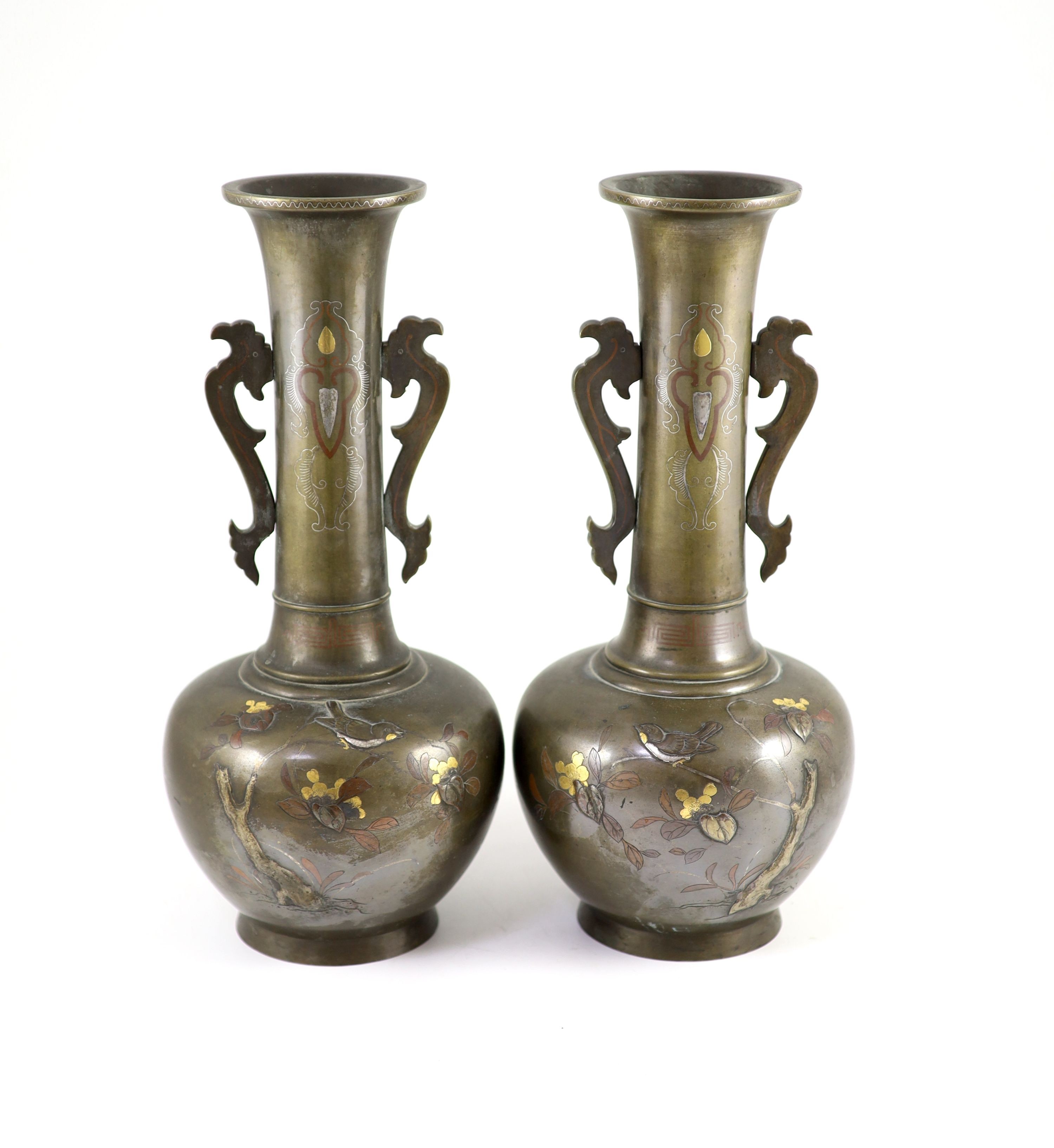 A pair of Japanese bronze and mixed metal bottle vases, Meiji period, 36cm high, patchy patina